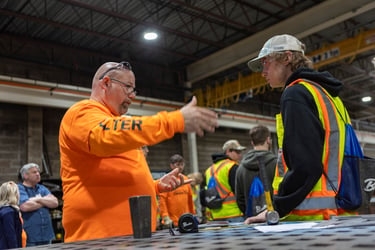 Jeremy Foss teaching high schoolers at career fair about the skilled trades