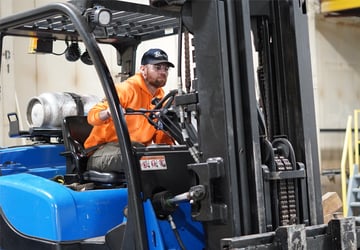 Moving heavy machinery with forklift