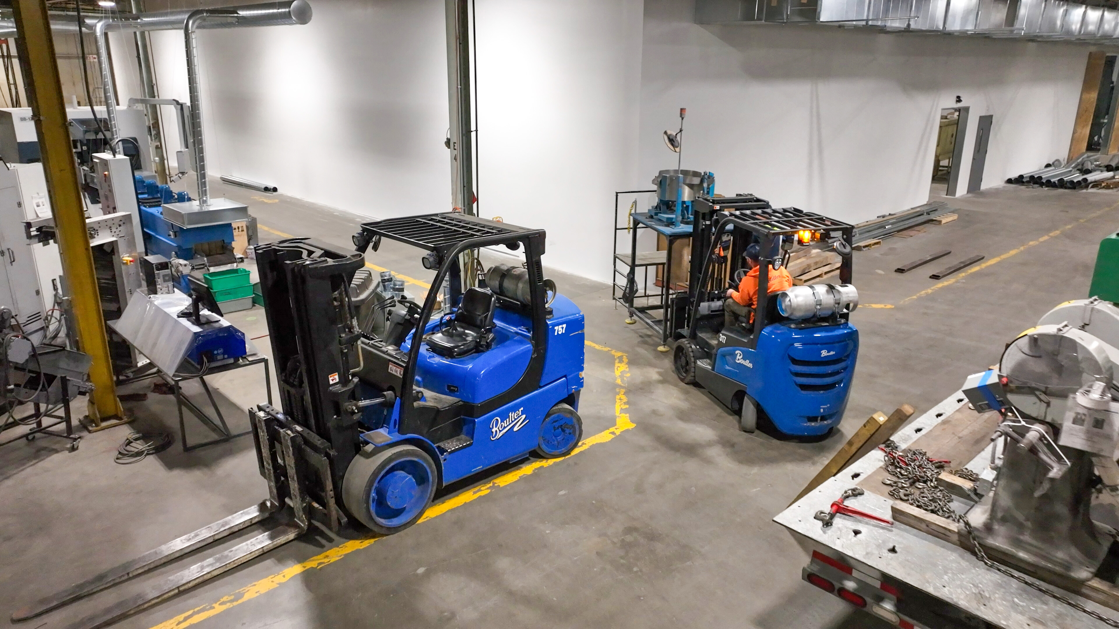 Forklift maneuvering through manufacturing floor