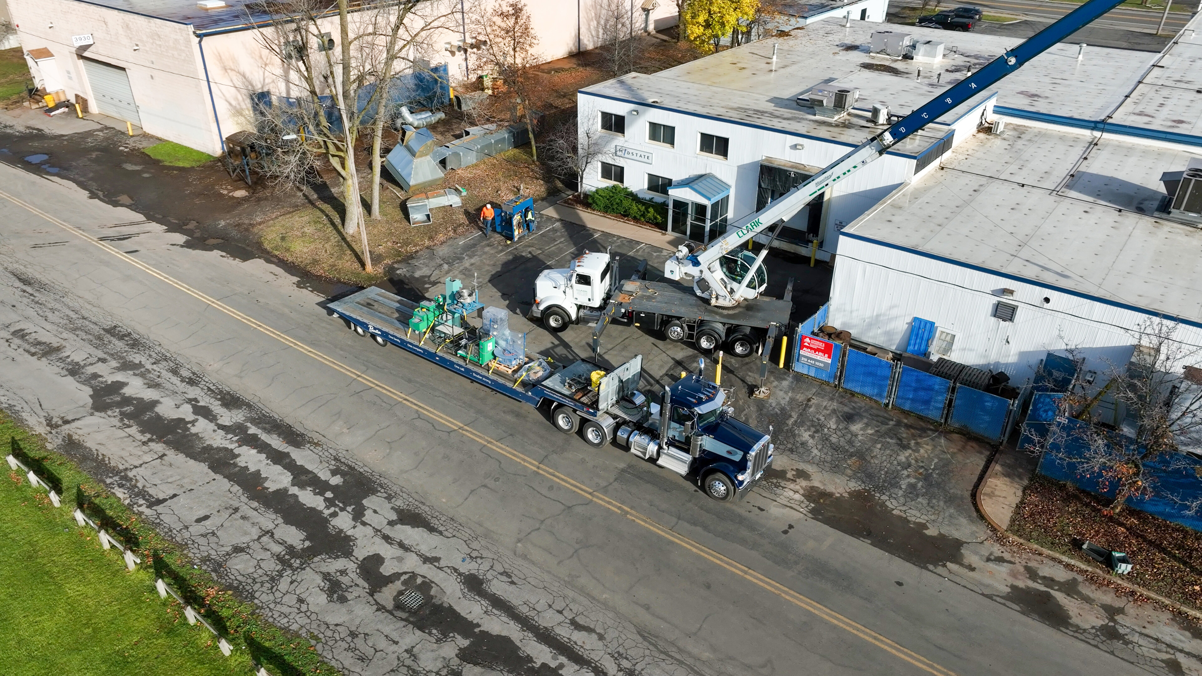 Removing Midstate Spring's machinery with a crane and forklifts